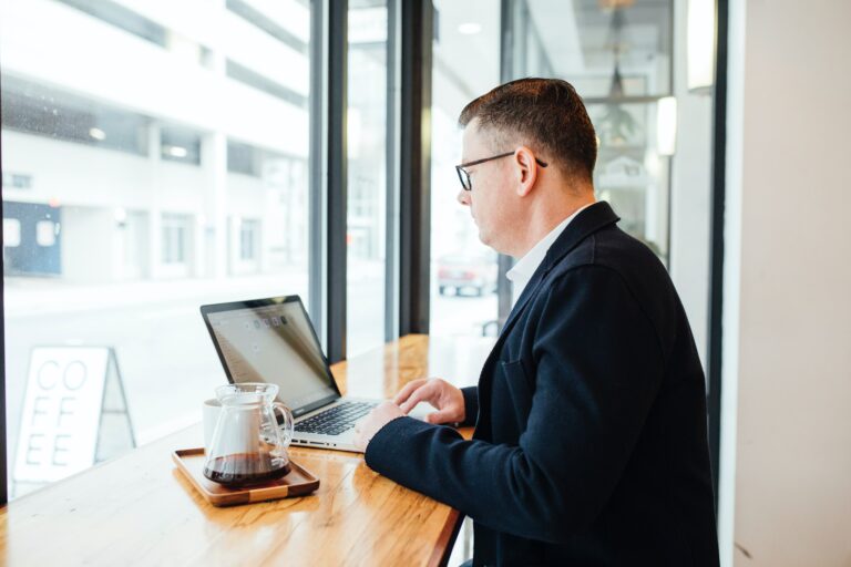 Man on computer, writing a LinkedIn message